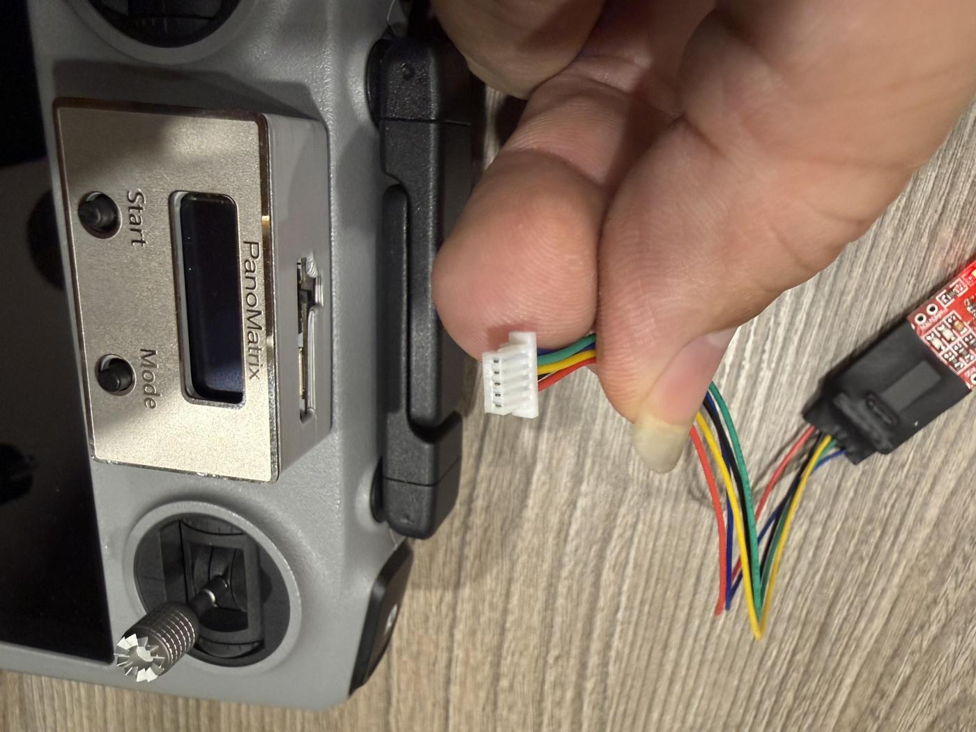 1. Connect the controller — align the 5-pin JST connector with the port.